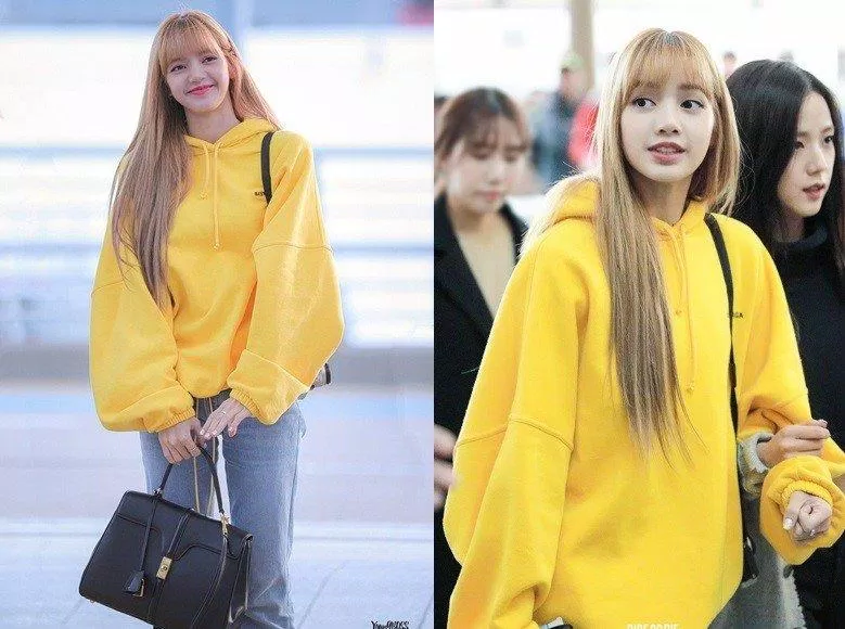 "Mặt trời nhỏ" Lisa thu hút ánh nhìn của bao người với hoodie vàng ấm áp và chiếc quần jean basic.(nguồn ảnh: internet.)