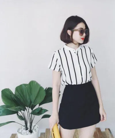 Chân váy ngắn trên đầu gối là item không thể thiếu của nàng "nấm lùn". (Nguồn: Internet)