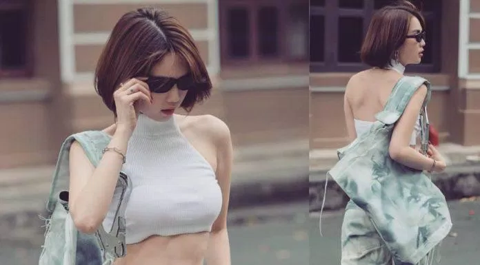 Ngọc Trinh mặc Croptop 3 lỗ cổ cao với quần jean ống rộng tuy "nam tính" nhưng lại gợi cảm