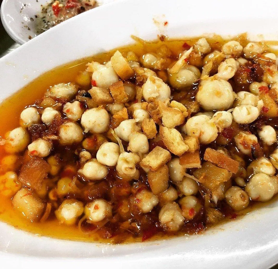 Răng mực xào bơ tỏi cũng là món ăn nên thử tại Ốc Đào (nguồn: ig pupeodzv)
