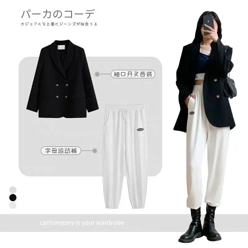 Blazer đen đi cùng cây đồ đen trắng bên trong và boot cao cổ (Nguồn: BlogAnChoi) Blazer đen đi cùng cây đồ đen trắng bên trong và boot cao cổ (Nguồn: BlogAnChoi)