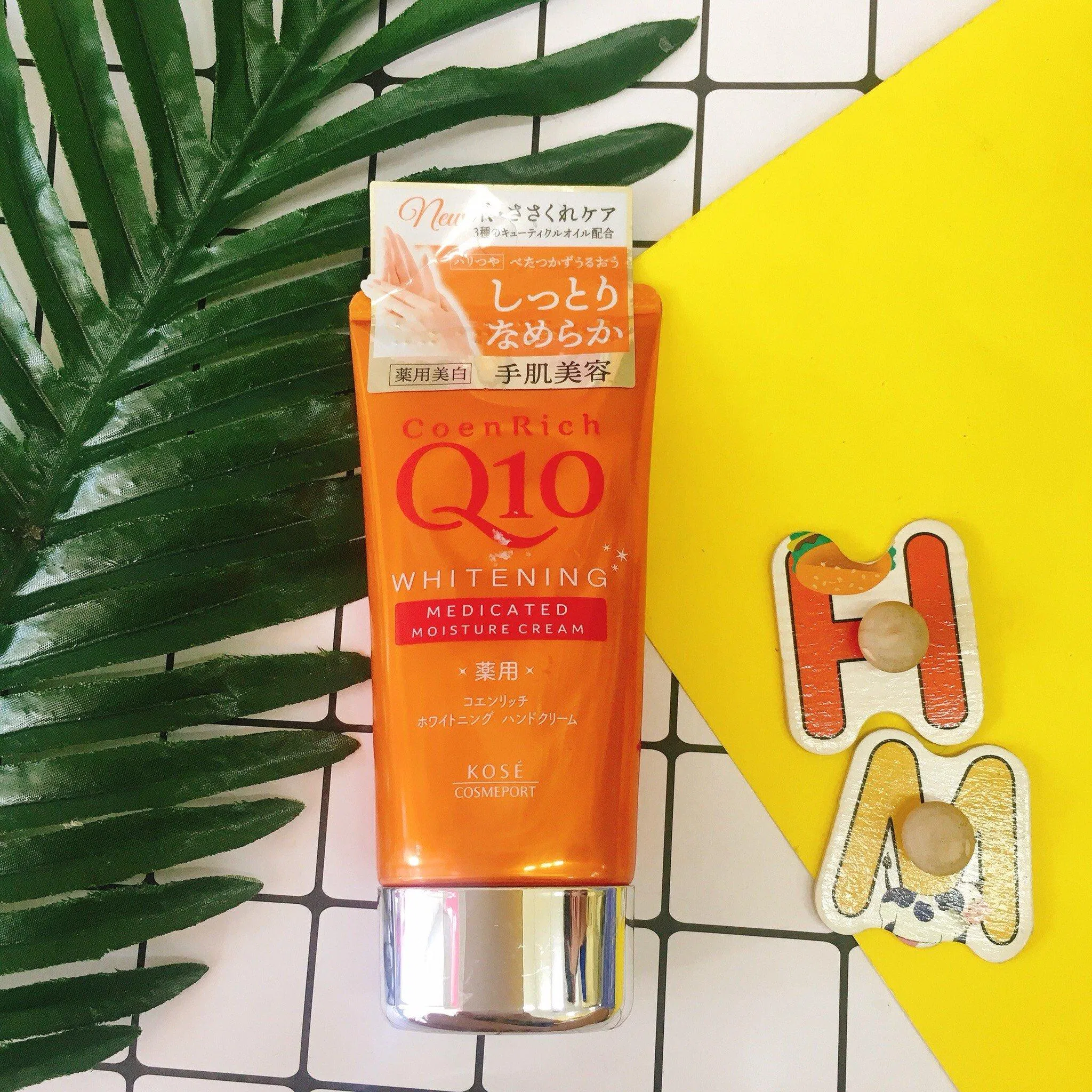Kem dưỡng da tay Kose Coenrich Q10 Whitening Medicated Hand Cream phiên bản màu cam (ảnh: internet)