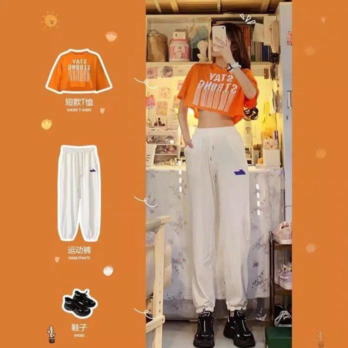 Nổi bật hơn với croptop màu cam và quần vải trắng (Nguồn: Internet)
