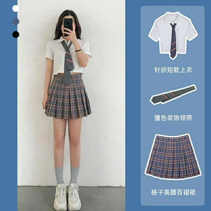 Style học sinh với croptop màu trắng, chân váy kẻ và cà vạt (Nguồn: Internet) Style học sinh với croptop màu trắng, chân váy kẻ và cà vạt (Nguồn: Internet)