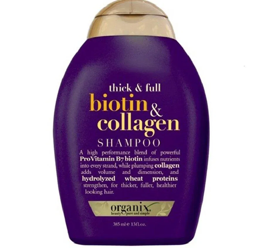 Dầu gội OGX Thick And Full Biotin Collagen với thiết kế tone tím- vàng bắt mắt và thu hút ( Nguồn: internet)