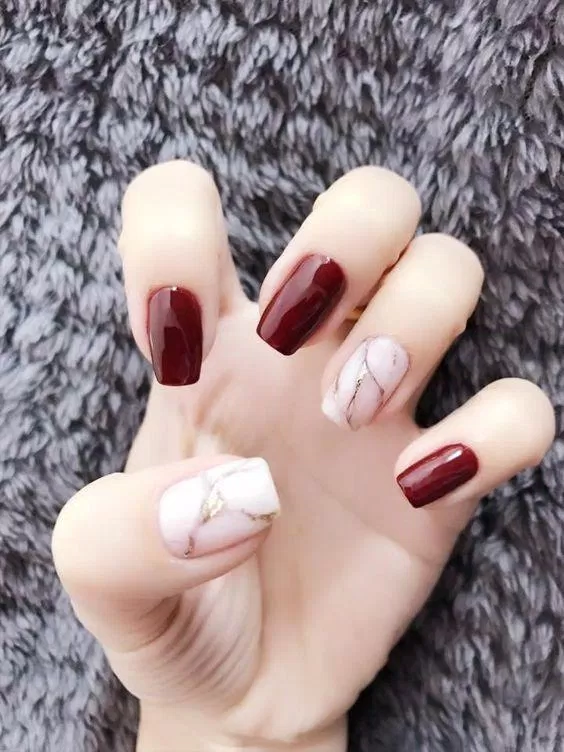 Mẫu nail đỏ mận sang trọng cho Tết (ảnh: internet)