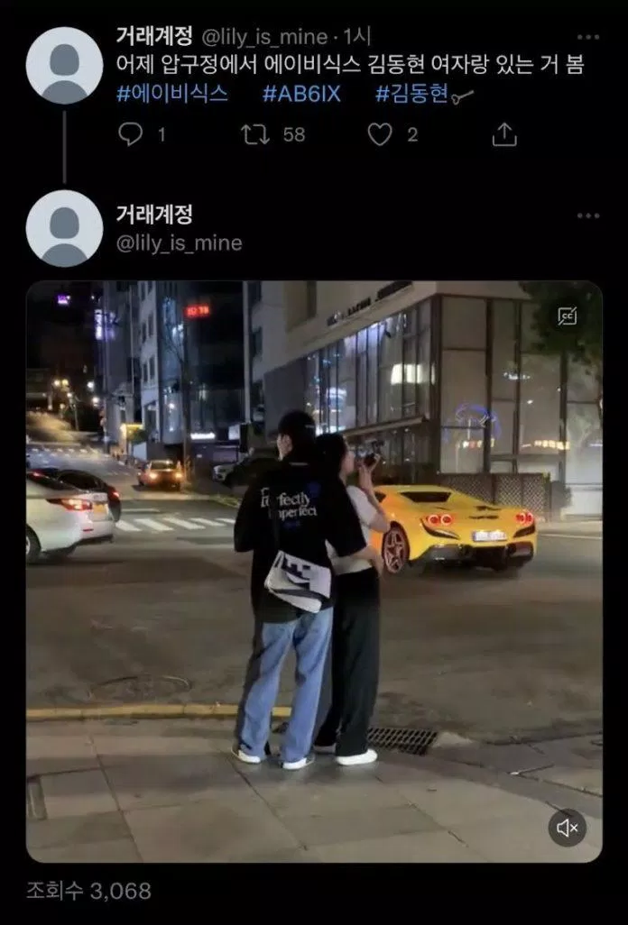 Kim Donghyun được bắt gặp thân mật ôm một cô gái trên đường phố sau buổi fanmeeting (Ảnh: Internet)