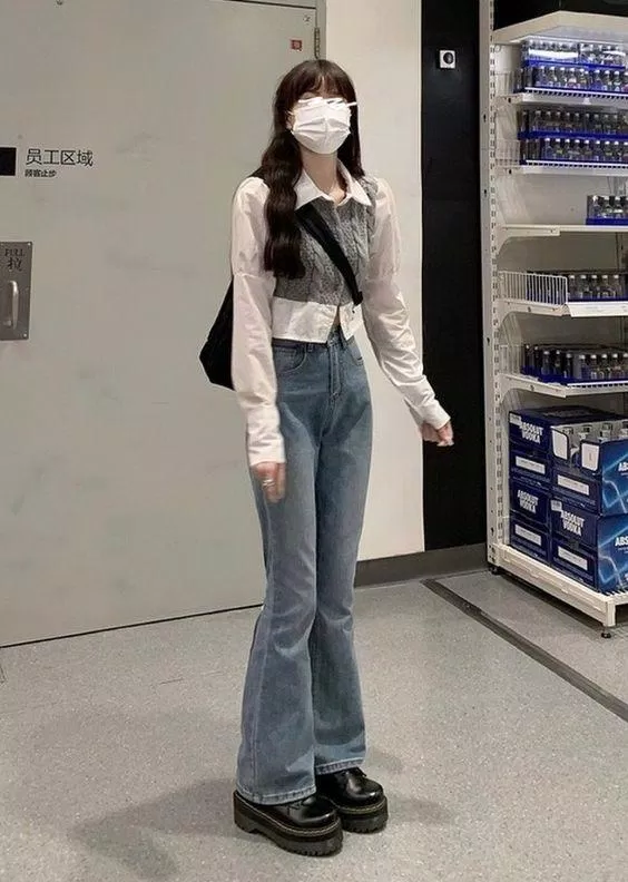 Đôi boots đế cao không chỉ phù hợp với túi xách mà còn giúp tăng chiều cao lên đáng nể luôn đó! (Nguồn: Internet).