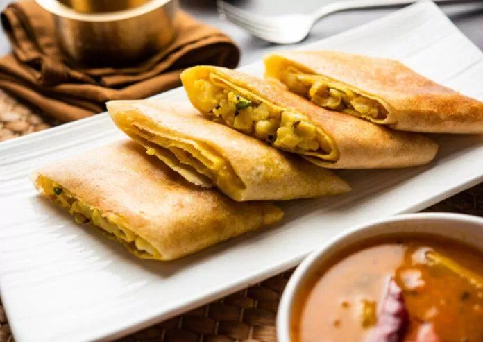 Cut Masala dosa or spring dosa is a South Indian meal served with sambhar and coconut chutney.