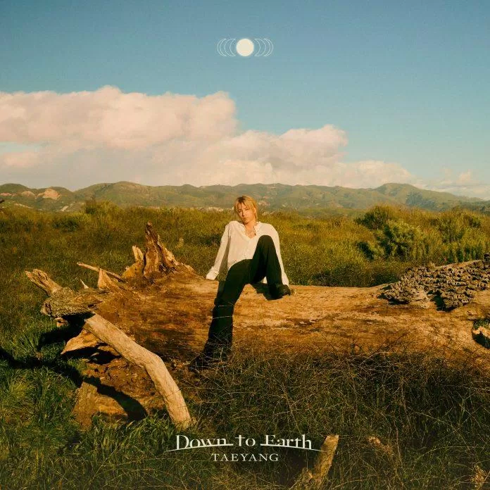 Tae Yang như hiện thân của mặt trời hạ cánh xuống Trái Đất trong bìa album "Down to Earth" (Ảnh: Internet)