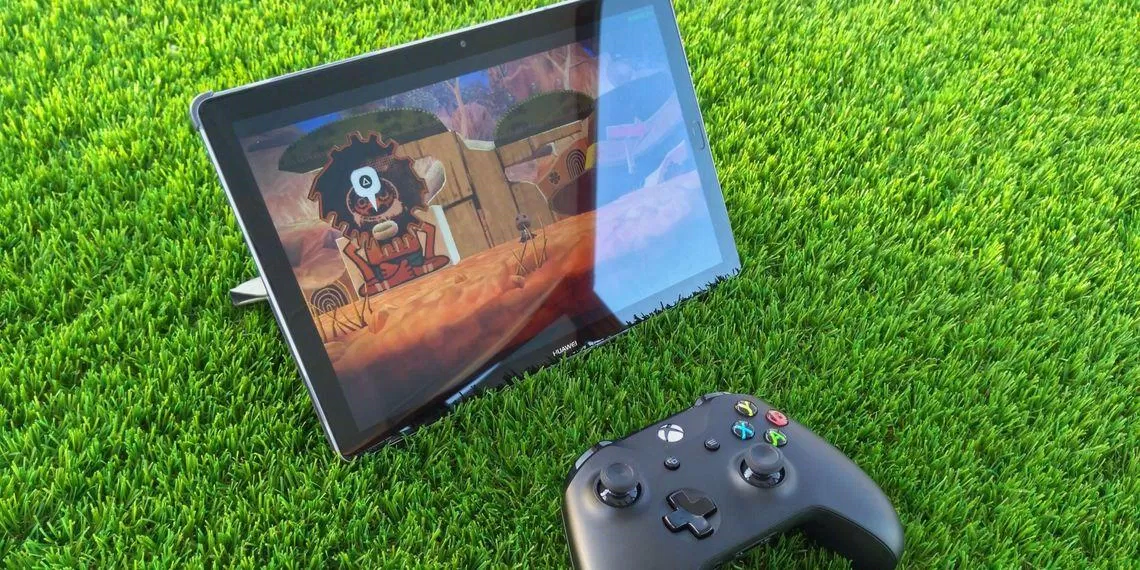 Chơi game di động trên iPad với bộ điều khiển cầm tay (Ảnh: Internet)