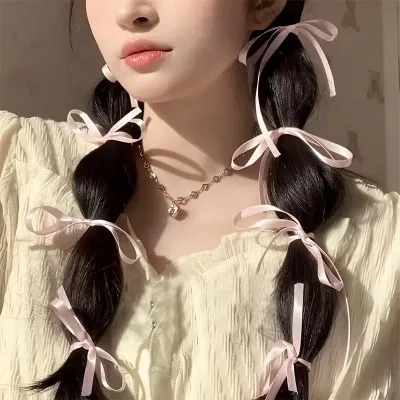 Kiểu tóc hot Tết 2025: Kiểu tóc buộc nơ